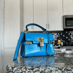 ALDO neon blue small purse